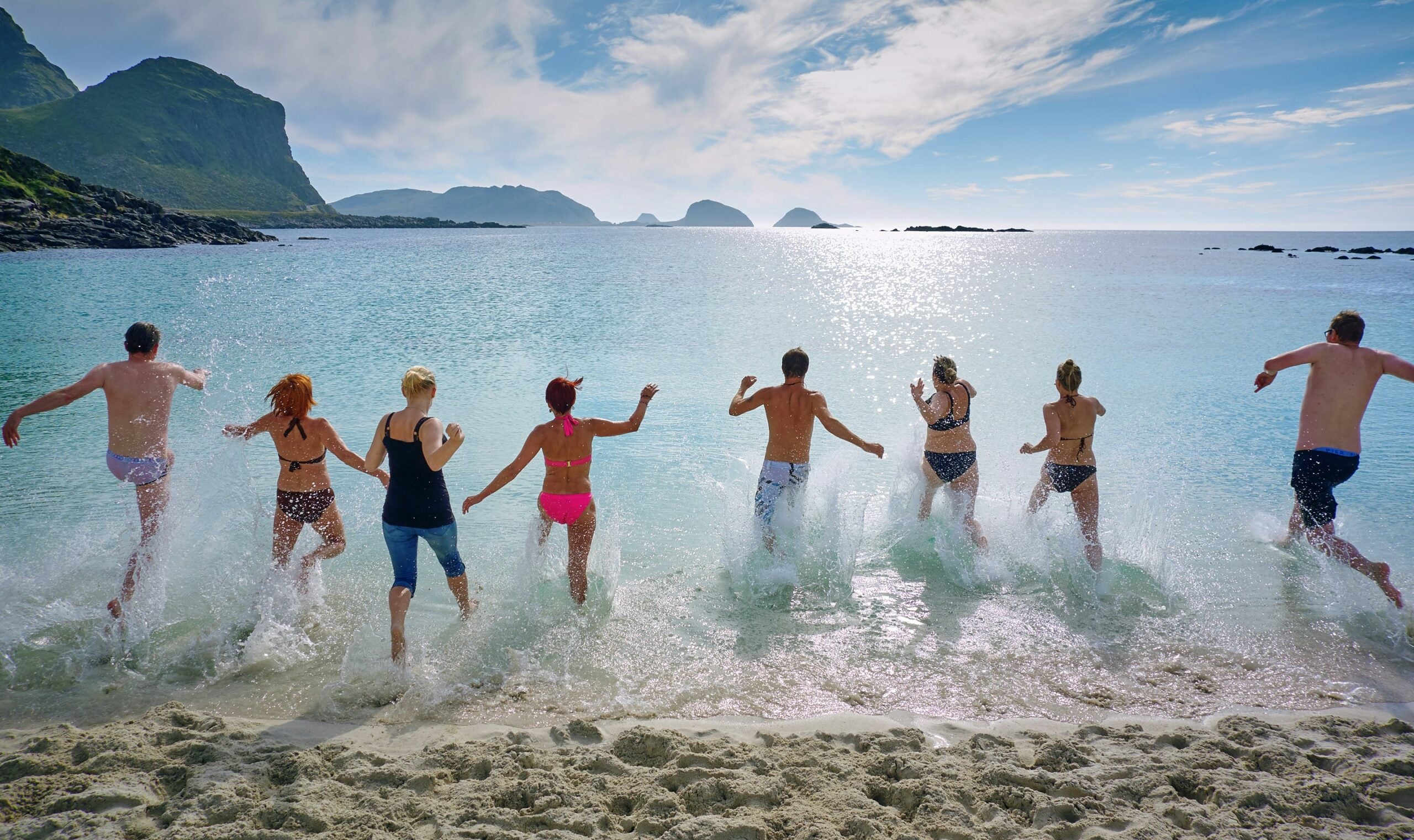 People Running into the Ocean by Vidar Nordli